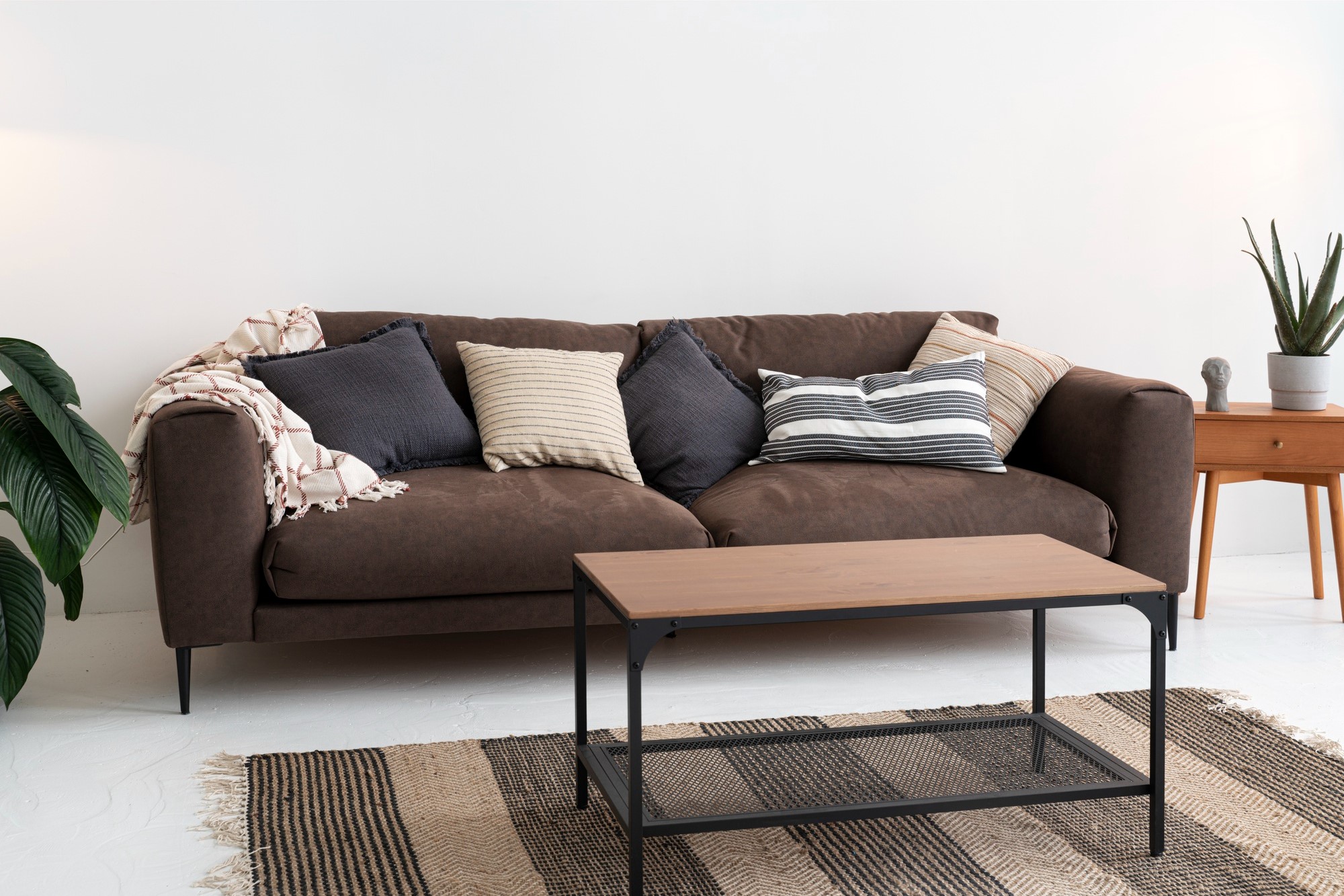 What color goes with brown sofa?